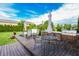 Outdoor kitchen featuring stainless steel grill, sink, and plenty of counter space, perfect for summer entertaining at 7320 Corwin Ct, Indianapolis, IN 46259