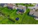 An inviting backyard features a manicured lawn, jacuzzi, and a trampoline in the fenced-in yard at 7320 Corwin Ct, Indianapolis, IN 46259