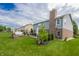 Backyard with a patio, hot tub, and nicely landscaped garden at 7320 Corwin Ct, Indianapolis, IN 46259