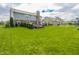 Backyard with a patio area, hot tub, and plenty of green space at 7320 Corwin Ct, Indianapolis, IN 46259