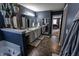 Elegant bathroom with dual vanities, a soaking tub, and seamless flow into the adjacent bedroom, maximizing space at 7320 Corwin Ct, Indianapolis, IN 46259