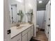 Well-lit bathroom with vanity, quartz counters, and a shower/toilet combo at 7320 Corwin Ct, Indianapolis, IN 46259