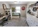 Bedroom features a daybed, gray carpet, a ceiling fan, and unique decorations at 7320 Corwin Ct, Indianapolis, IN 46259