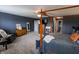 View of spacious bedroom with four-poster bed, a dresser, and a seating area at 7320 Corwin Ct, Indianapolis, IN 46259