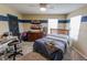 Decorated bedroom with carpet, ceiling fan and wall art at 7320 Corwin Ct, Indianapolis, IN 46259