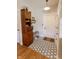 Inviting entryway with decorative tile flooring, built in cabinet and desk offers functionality and style at 7320 Corwin Ct, Indianapolis, IN 46259