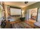 Inviting home theater featuring built-in bookshelves, projector screen, and comfortable seating with an open doorway at 7320 Corwin Ct, Indianapolis, IN 46259