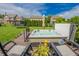 Outdoor hot tub on a wooden deck with chairs and a view of the backyard at 7320 Corwin Ct, Indianapolis, IN 46259