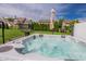 Close-up of an outdoor hot tub with clear water and backyard view at 7320 Corwin Ct, Indianapolis, IN 46259