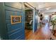 View of a library from the foyer, with a barn door and a wall of bookshelves at 7320 Corwin Ct, Indianapolis, IN 46259