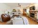 Cozy living room with stone fireplace, neutral-toned furniture, and stylish decor at 7320 Corwin Ct, Indianapolis, IN 46259