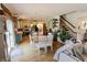 Open-concept living space featuring a dining table and view into the modern kitchen at 7320 Corwin Ct, Indianapolis, IN 46259