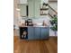 Stylish wet bar area with a copper countertop, wine fridge, and custom cabinets, perfect for entertaining guests at 7320 Corwin Ct, Indianapolis, IN 46259