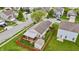 Aerial view showcases a well-maintained property with a fenced backyard, patio, and lush greenery at 805 Sunvista Dr, Avon, IN 46123