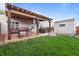 Green backyard featuring a patio, a built-in grilling area, and storage shed at 805 Sunvista Dr, Avon, IN 46123