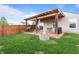 Great backyard with built-in grilling area, patio, and green grass, perfect for relaxing at 805 Sunvista Dr, Avon, IN 46123