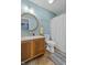 Bathroom featuring a classic vanity, round mirror, and bathtub with shower at 805 Sunvista Dr, Avon, IN 46123