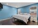 Comfortable bedroom featuring hardwood floors, recessed lighting, and light blue painted walls at 805 Sunvista Dr, Avon, IN 46123
