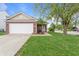 Charming home featuring a well-manicured lawn, attached garage, and inviting front porch at 805 Sunvista Dr, Avon, IN 46123