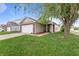 Charming home featuring a well-manicured lawn, attached garage, and inviting front porch at 805 Sunvista Dr, Avon, IN 46123