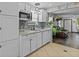 Kitchen boasts stainless steel appliances, granite countertops, and access to the living room at 805 Sunvista Dr, Avon, IN 46123
