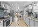 Bright kitchen features granite countertops, stainless steel appliances, and mosaic backsplash at 805 Sunvista Dr, Avon, IN 46123