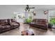 Comfortable living room featuring wood floors, a ceiling fan, and plenty of natural light at 805 Sunvista Dr, Avon, IN 46123