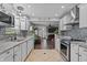 Open concept living area boasts a fireplace and easy kitchen access at 805 Sunvista Dr, Avon, IN 46123