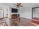 Comfortable living room featuring wood floors, a ceiling fan, and a fireplace at 805 Sunvista Dr, Avon, IN 46123