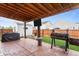 Backyard patio featuring grill, firepit, and storage shed creating an inviting outdoor space at 805 Sunvista Dr, Avon, IN 46123