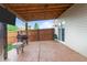 Covered patio with stamped concrete, wooden beams, and outdoor tv great for entertaining at 805 Sunvista Dr, Avon, IN 46123