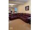 A large sectional sofa in the basement provides a comfortable relaxation zone at 8130 Winterset Cir, Indianapolis, IN 46214