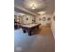 Spacious basement featuring a billiard table and carpeted floors at 8130 Winterset Cir, Indianapolis, IN 46214
