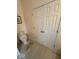 This bathroom has a toilet, closet, and tile flooring that creates a cozy and functional space at 8130 Winterset Cir, Indianapolis, IN 46214