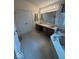 Spacious bathroom featuring tile floors, double vanity, and soaking tub with tile surround at 8130 Winterset Cir, Indianapolis, IN 46214