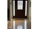 Inviting foyer with gleaming wood floors and staircase at 8130 Winterset Cir, Indianapolis, IN 46214