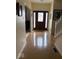 Inviting foyer with gleaming wood floors and staircase at 8130 Winterset Cir, Indianapolis, IN 46214