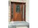 Elegant front door featuring decorative glass panels and a sidelight at 8130 Winterset Cir, Indianapolis, IN 46214