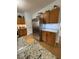 This kitchen has stainless steel appliances, wooden cabinets, and granite countertops at 8130 Winterset Cir, Indianapolis, IN 46214