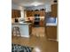 This well-lit kitchen has wooden cabinets and granite countertops at 8130 Winterset Cir, Indianapolis, IN 46214