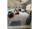 Spacious living room features a fireplace, comfortable seating, and an array of decorative artwork at 8130 Winterset Cir, Indianapolis, IN 46214