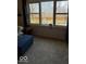 Bright living room features a view to the backyard through a large window at 8130 Winterset Cir, Indianapolis, IN 46214