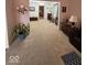 Cozy living room featuring plush carpeting and comfortable seating at 8130 Winterset Cir, Indianapolis, IN 46214