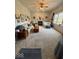 Cozy living room with fireplace, nautical decor, and large windows offering ample natural light at 8130 Winterset Cir, Indianapolis, IN 46214