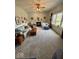 Cozy living room with fireplace, nautical decor, and large windows offering ample natural light at 8130 Winterset Cir, Indianapolis, IN 46214