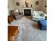 Comfortable living room featuring a fireplace, recliner, and ottoman perfect for relaxation at 8130 Winterset Cir, Indianapolis, IN 46214