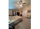 Bright main bedroom with a king bed, TV, and vaulted ceilings at 8130 Winterset Cir, Indianapolis, IN 46214