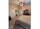 Comfortable main bedroom with ceiling fan, carpet, and beige colored walls at 8130 Winterset Cir, Indianapolis, IN 46214