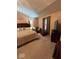 Serene main bedroom with a king bed, TV, and comfortable seating area at 8130 Winterset Cir, Indianapolis, IN 46214