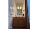 Updated powder room featuring a vanity with a marble countertop at 8130 Winterset Cir, Indianapolis, IN 46214